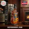 This guitar shaped whiskey bottle features Slash artwork next to a black Jack Daniels collectible box!