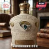 Cream-colored Jacksonville Jaguars 31st anniversary glass liquor bottle with gold crown cap and jaguar team logo relief.!