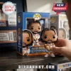Jalen Brunson Funko Pop vinyl figure holding gold trophy with blue and orange packaging on a wooden shelf.!