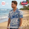 Man wearing a blue and beige patterned button-down shirt featuring off-road vehicle illustrations and vintage mountain art.!