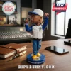 Jermaine Dupri bobblehead figure wearing a blue and white varsity jacket, Atlanta cap, and jeans on a blue circular stand.!