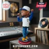 Jermaine Dupri bobblehead figure wearing a white and blue varsity jacket, jeans, and an Atlanta cap holding a microphone.!