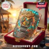 Jimmy Buffett Margaritaville whiskey glass with parrot and guitar graphic in velvet-lined box against a beach sunset.!