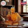 Amber glass Johnny Cash decanter shaped like the musician playing guitar and gesturing with his middle finger on a desk.!