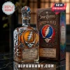 Jose Cuervo Grateful Dead tequila bottle with silver dancing bear decals and skull logo, standing beside matching box.!