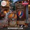 Jose Cuervo Grateful Dead tequila bottle with silver skull and bear emblems next to matching box and whiskey glass.!