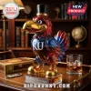 Kansas Jayhawks mascot shaped glass whiskey decanter with gold beak, feet, and top hat on a wood desk with a glass.!