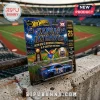 Kansas Jayhawks 2026 Big 12 baseball champion Hot Wheels die-cast car in blue blister packaging on a concrete ledge.!