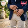Kappa Alpha Psi fraternity belt buckle with gold trim and red crest center worn by a man in a navy blazer and tan pants.!