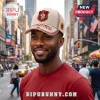 Cream baseball cap with Kappa Alpha Psi emblem and text reading Achievement in Every Field against a blurred city street.!