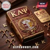 Kappa Alpha Psi flip lighter in gold and crimson featuring fraternity crest, greek letters, and cane emblems on wood desk.!