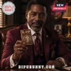 Man in a crimson suit holding a gold Kappa Alpha Psi fraternity lighter with an engraved shield and Greek lettering.!