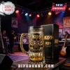 KISS 53rd anniversary glass beer mug with gold embossed band members and stage graphics, standing next to a black box.!