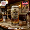 KISS band themed glass beer stein with gold filigree handle, band member portraits, and 53rd anniversary text on bar top.!