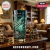 Green Kraken 2026 Anniversary glass tumbler with etched octopus and ship artwork on a wooden desk with nautical figurines.!