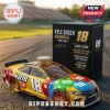 Kyle Busch M&M's themed yellow race car whiskey bottle with a gold cap next to a black commemorative display box.!