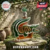 Lacoste branded glass liquor decanter shaped like a crocodile filled with amber liquid on a stone pedestal.!