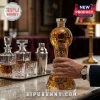 Soccer ball shaped glass decanter labeled Liga BBVA Mexican Football 83rd Anniversary with metal base emblems on bar top.!