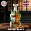 Green and white mecha robot head glass decanter with crystal stopper on a wooden table with scattered coffee beans.!