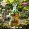 Gundam-inspired glass whiskey decanter with green and gold accents on a mossy stone wall in a garden setting.!