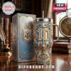 Lionel Messi commemorative metal tumbler with gold accents, number 10, AFA crest, and matching display box on wood desk.!