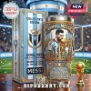 Lionel Messi commemorative tumbler with gold accents, matching box, ring, and trophy on a table at a stadium.!