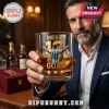 Lionel Messi number 10 whiskey glass with gold etching, held by a man in a navy blazer, with a maroon gift box nearby.!