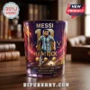 Lionel Messi rocks glass featuring gold typography, a stadium background, and three soccer balls on a dark wooden surface.!
