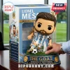 Lionel Messi collectible vinyl figure in Argentina kit standing on a base labeled THE G.O.A.T. with a display box behind.!