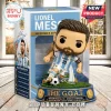 Lionel Messi vinyl collectible figure in Argentina jersey on a circular grass base with a display box labeled The G.O.A.T.!