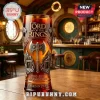 Lord of the Rings 25th anniversary glass with metal axe relief, stone carvings, and orange tint on a wooden bar counter.!