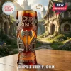 Lord of the Rings 25th anniversary glass with metal axe relief and Forged in Stone text on a wooden table in Rivendell.!