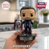 Luis Enrique vinyl figurine holding a silver Champions League trophy and tactical board on a branded display stand.!