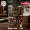 Lynyrd Skynyrd America 250 whiskey glass featuring embossed American flag, eagle emblem, and 1776-2026 text on wooden table.!