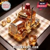 Amber whiskey in a glass decanter shaped like a semi-truck with Maker's Mark branding and red wax cap on a plaid mat.!
