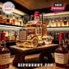 Maker's Mark semi-truck shaped glass whiskey decanter with red wax stopper on a rustic wooden stand in a home bar setting.!