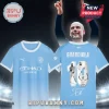 Manchester City light blue jersey featuring Guardiola name and number 10 print with celebratory photo graphics.!