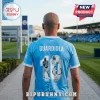 Man wearing a light blue Manchester City soccer jersey with Guardiola, number 10, and photo graphics on the back.!