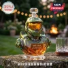 Halo Master Chief glass decanter with a gold visor, engraved 25th anniversary plate, sitting on a stone patio table.!