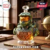 Master Chief faceted green glass whiskey decanter with gold visor and 25th anniversary inscription on desk.!