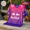 Pink and purple gradient V-neck jersey with white Red Bull logo, Oracle branding, and palm tree print on wooden surface.!