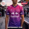 Man wearing a pink and purple gradient V-neck jersey featuring the Red Bull logo and palm tree silhouette graphics.!