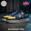 Custom Megadeth Vic Rattlehead sneakers with yellow toe box, blue graphic panels, gold swoosh, and metal stud accents.!