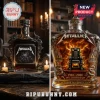 Metallica 45th anniversary glass whiskey bottle featuring electric chair imagery, metallic skull accents, and amber liquid.!