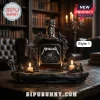 Metallica logo whiskey bottle on a gothic stone base with candles, set on a wooden table in a library.!