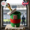 Green plastic drink cooler with a red band, white lid, and a gold World Cup trophy-themed straw topper with Mexico flag.!