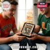 Zippo Miami Hurricanes lighter in a satin-lined display box held by two men wearing University of Miami apparel.!
