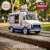 Mister Softee 70th anniversary model ice cream truck toy with white and blue paint, parked on a weathered wooden bench.!