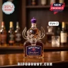 Motorhead Crown Royal anniversary glass whiskey decanter with horned devil sculptural stopper on a wooden bar top.!