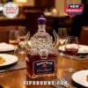 Motörhead Crown Royal glass whiskey bottle with custom skull topper and purple cap on a dining table.!